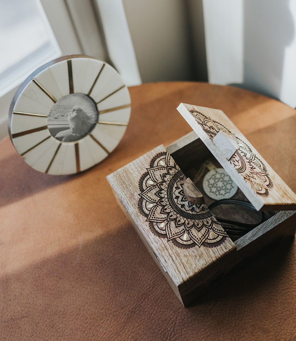 Handcrafted mango wood keepsake box with an intricate mandala design carved into the lid.