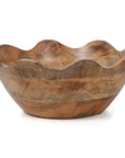 Wooden bowl with wavy edge on a white background