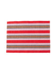 A red and white striped placemat with additional stripes in beige and brown colors