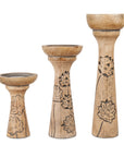 A set of three wooden pillar candleholders with lotus vine carvings, in varying sizes