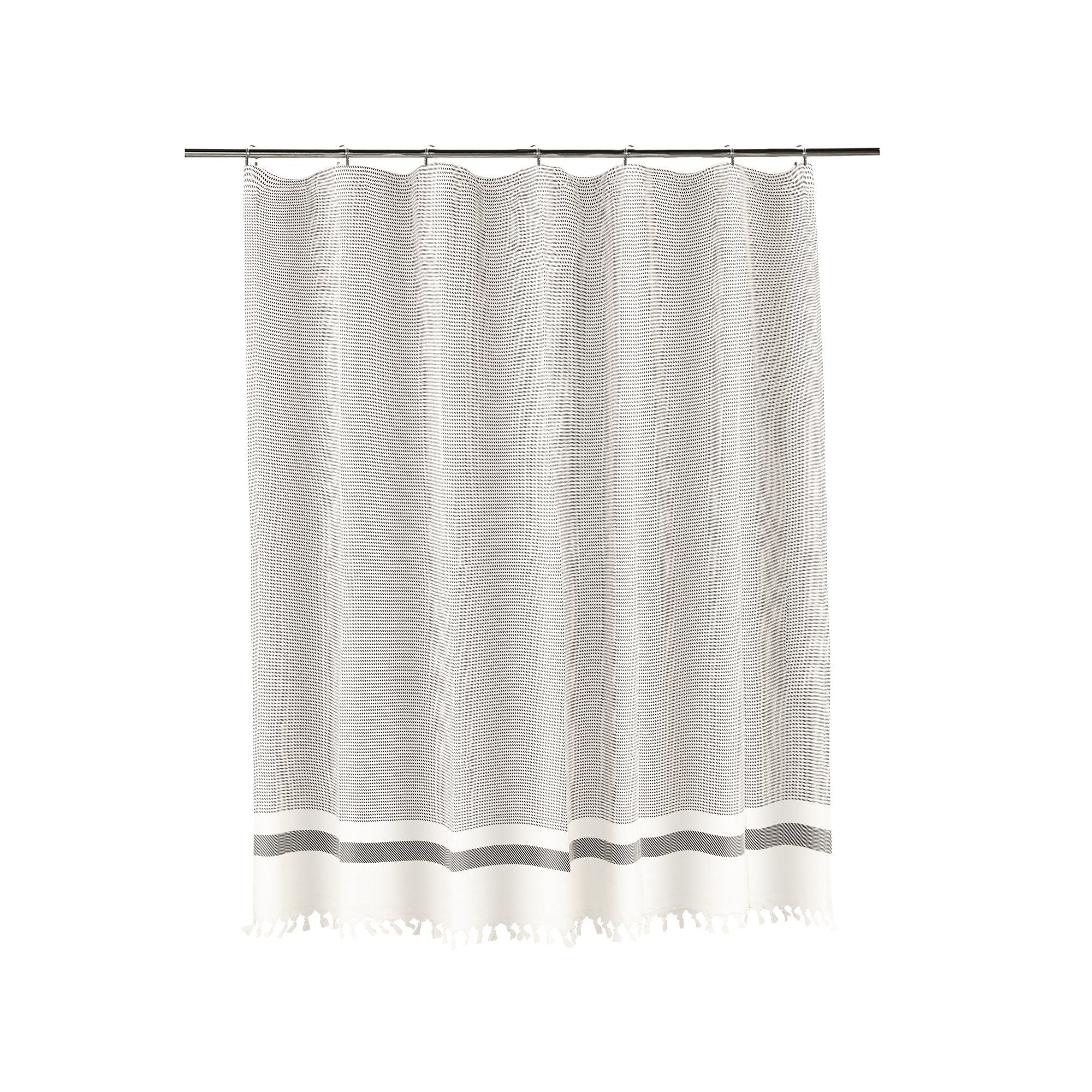 Striped shower curtain with tassels on a white background