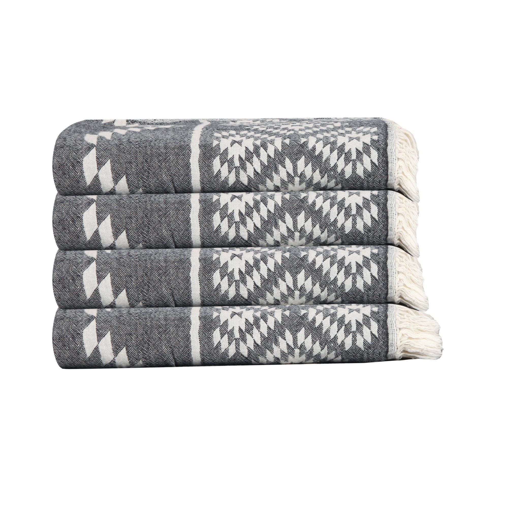 Stack of gray and white patterned towels on a white background
