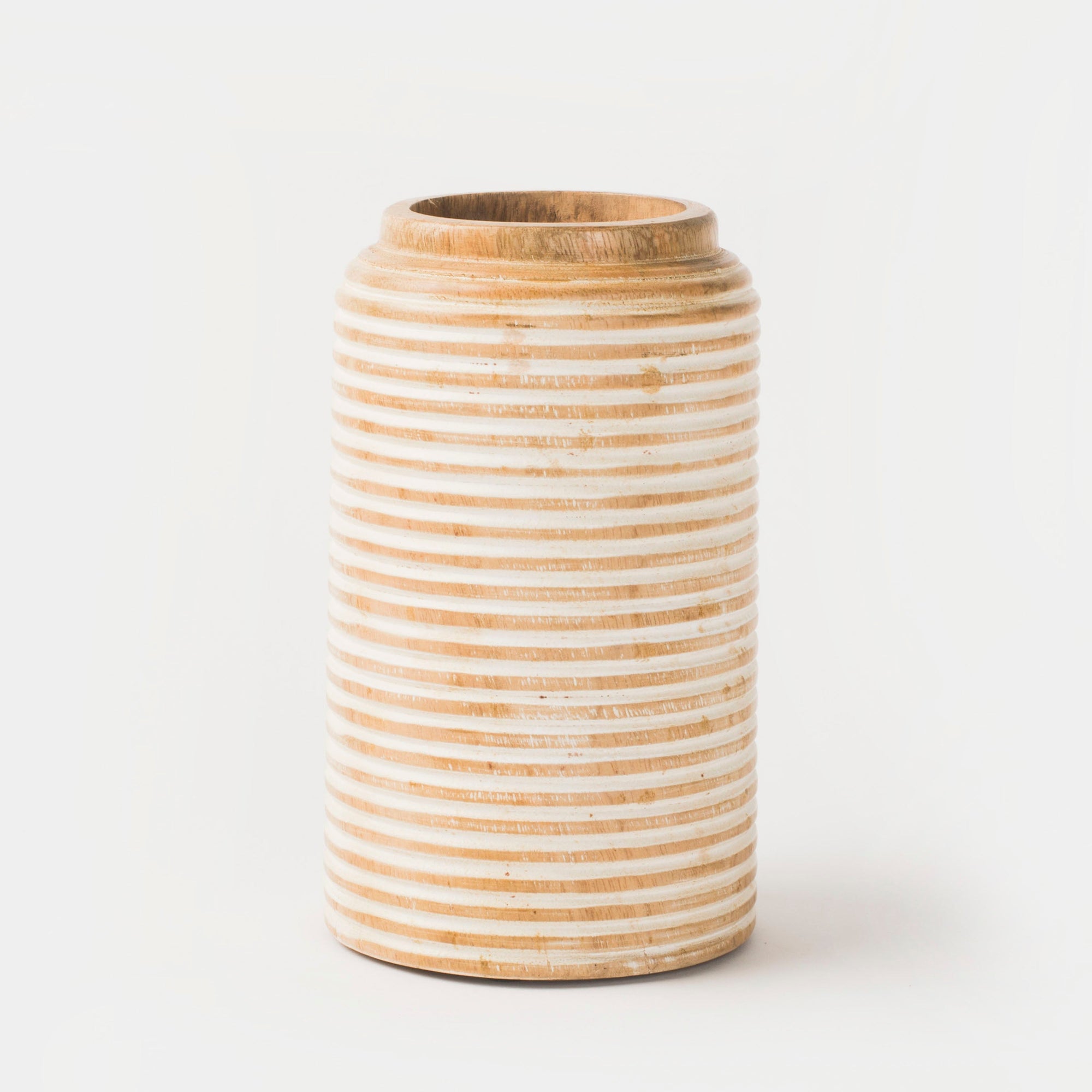 A cylindrical vase made of mango wood with a rustic white finish and etched lines