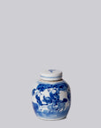 Blue and white ceramic jar with lid on a light gray background
