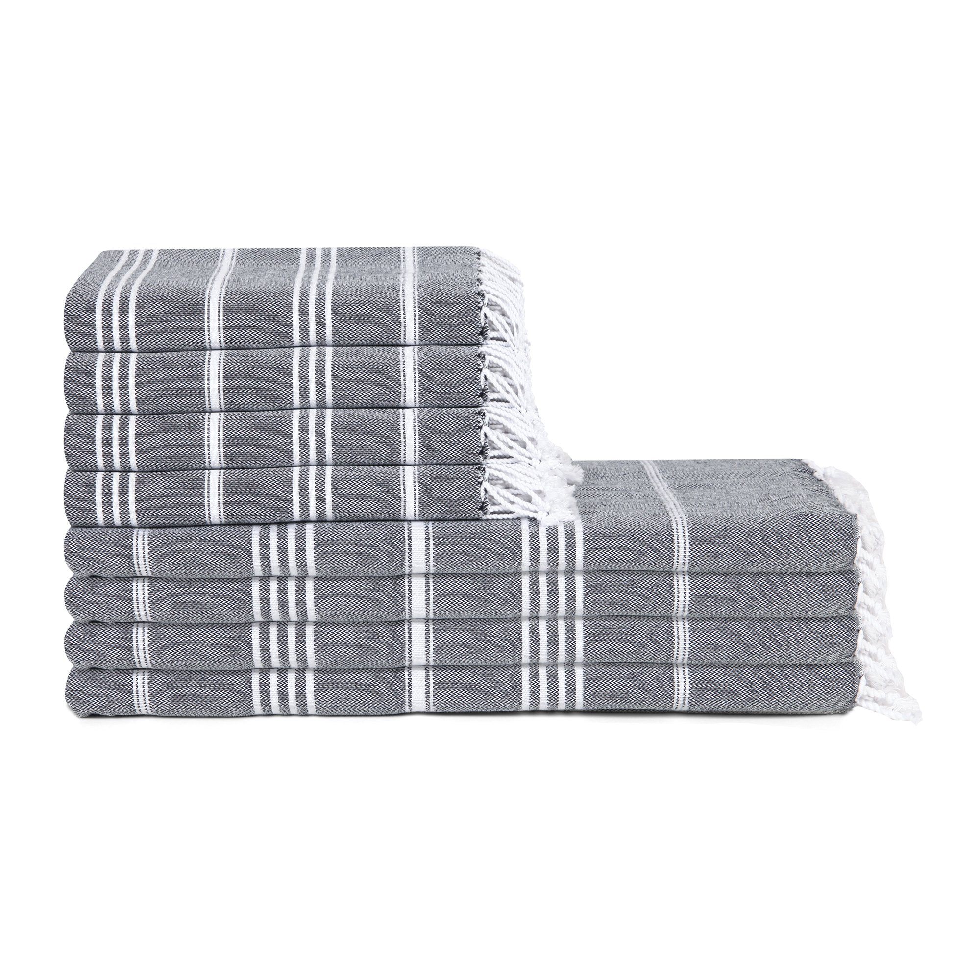 Stack of gray towels with white stripes and fringes on a white background