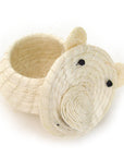 A white lidded basket hand woven out of sisal, designed to resemble a polar bear with the lid off