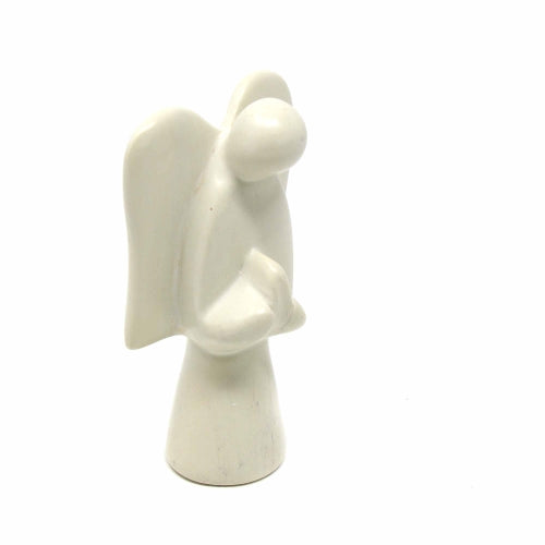 A hand-carved soapstone sculpture of an angel, with a predominantly gray and earthy tone, standing with wings extended