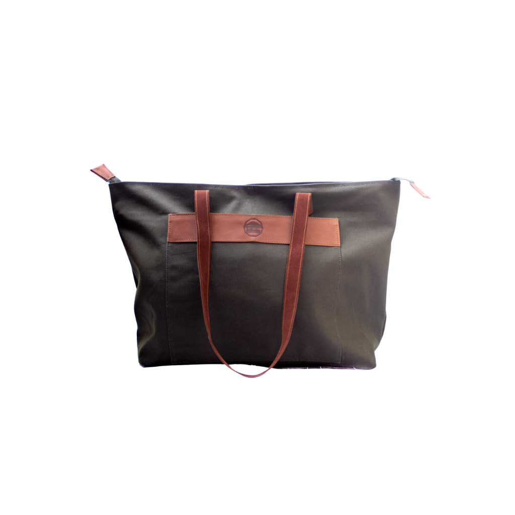 A green canvas tote bag with brown leather accents and dark brown straps, standing upright against a solid background.