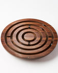 Wooden labyrinth puzzle on a white background