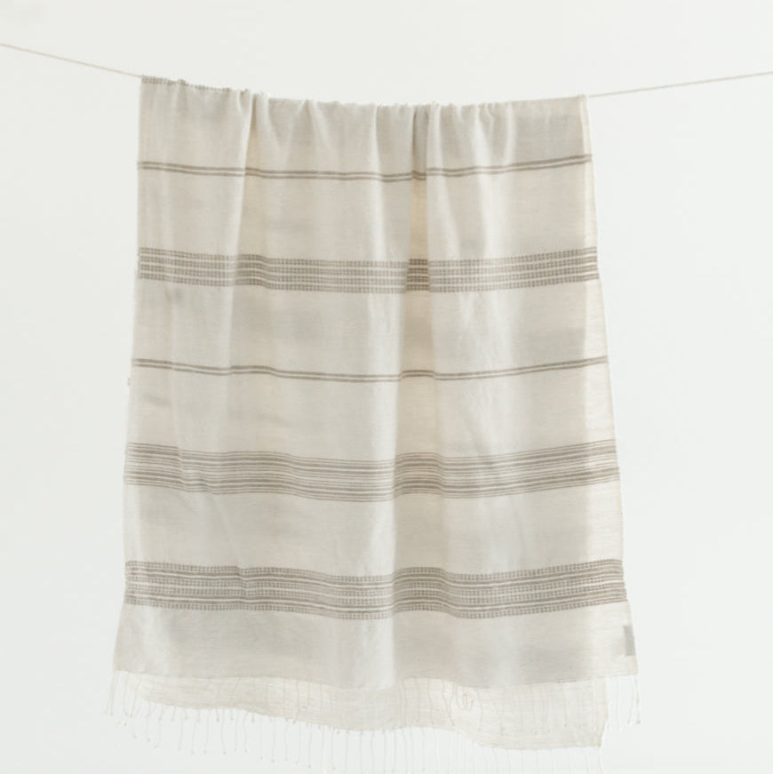 Striped towel hanging on a white background
