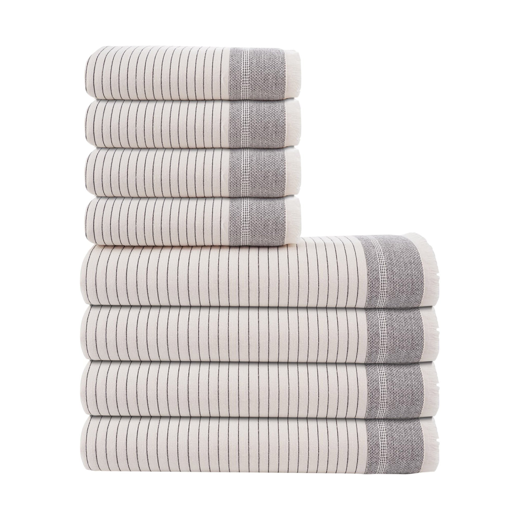 Stack of gray and white striped towels on a white background