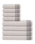 Stack of gray and white striped towels on a white background