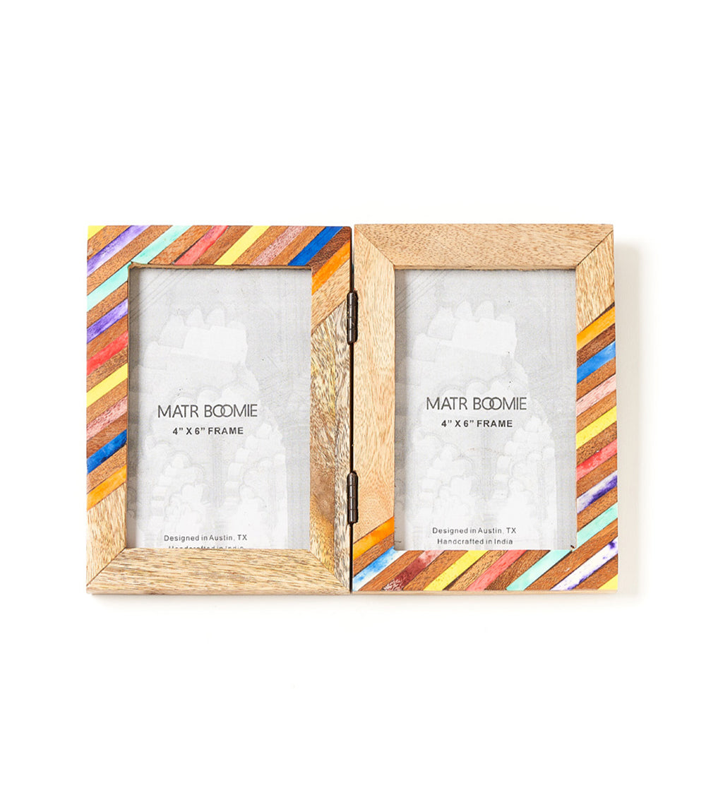 A multicolor double picture frame made with bone and wood, featuring a striped design on the borders, with a clear glass front.