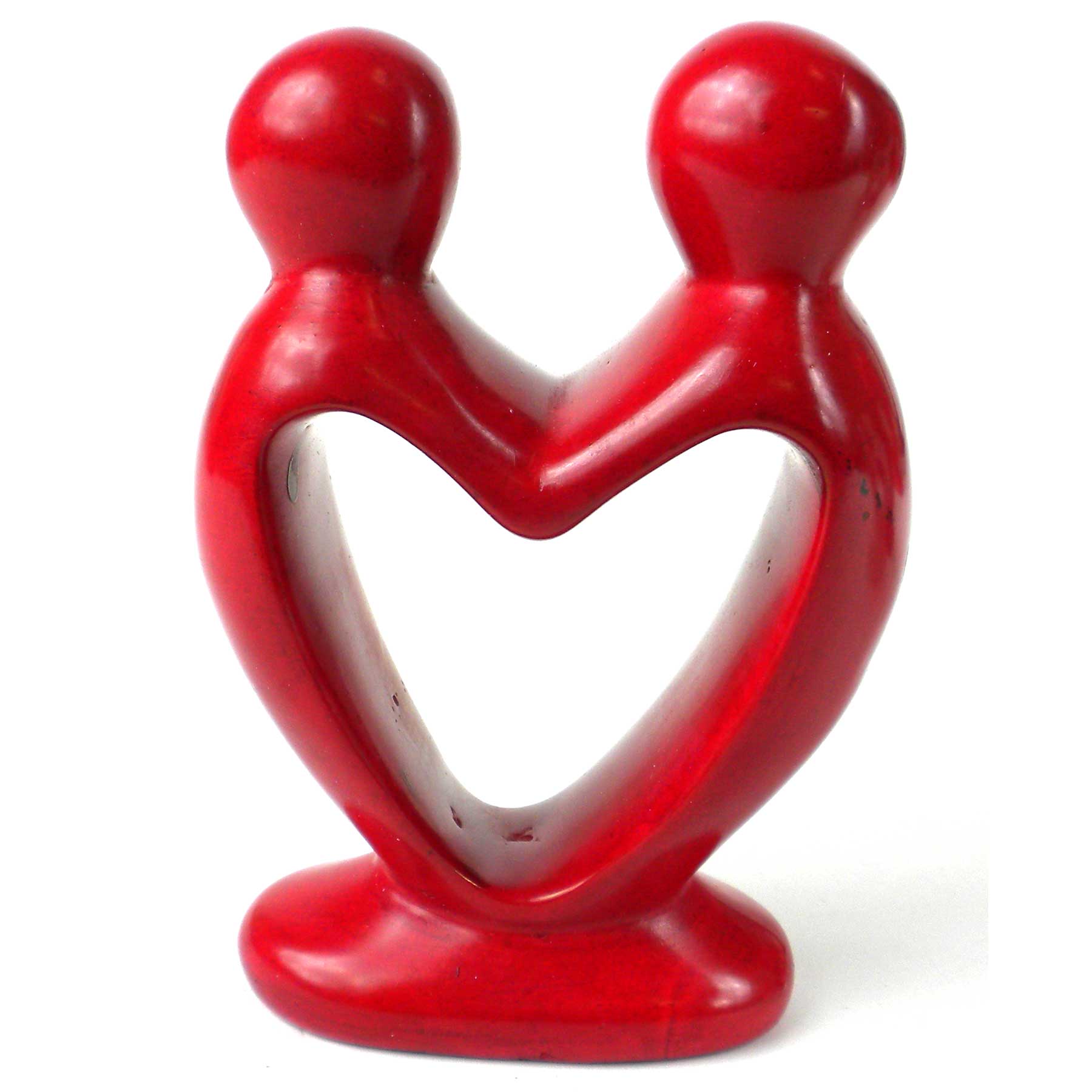 A hand-carved red soapstone sculpture of two figures forming a heart shape