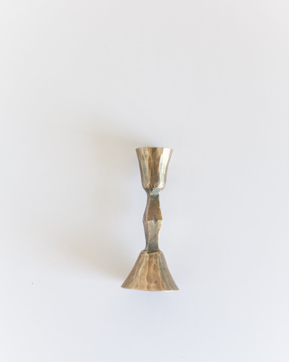Brass candle holder on a white background