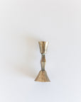 Brass candle holder on a white background