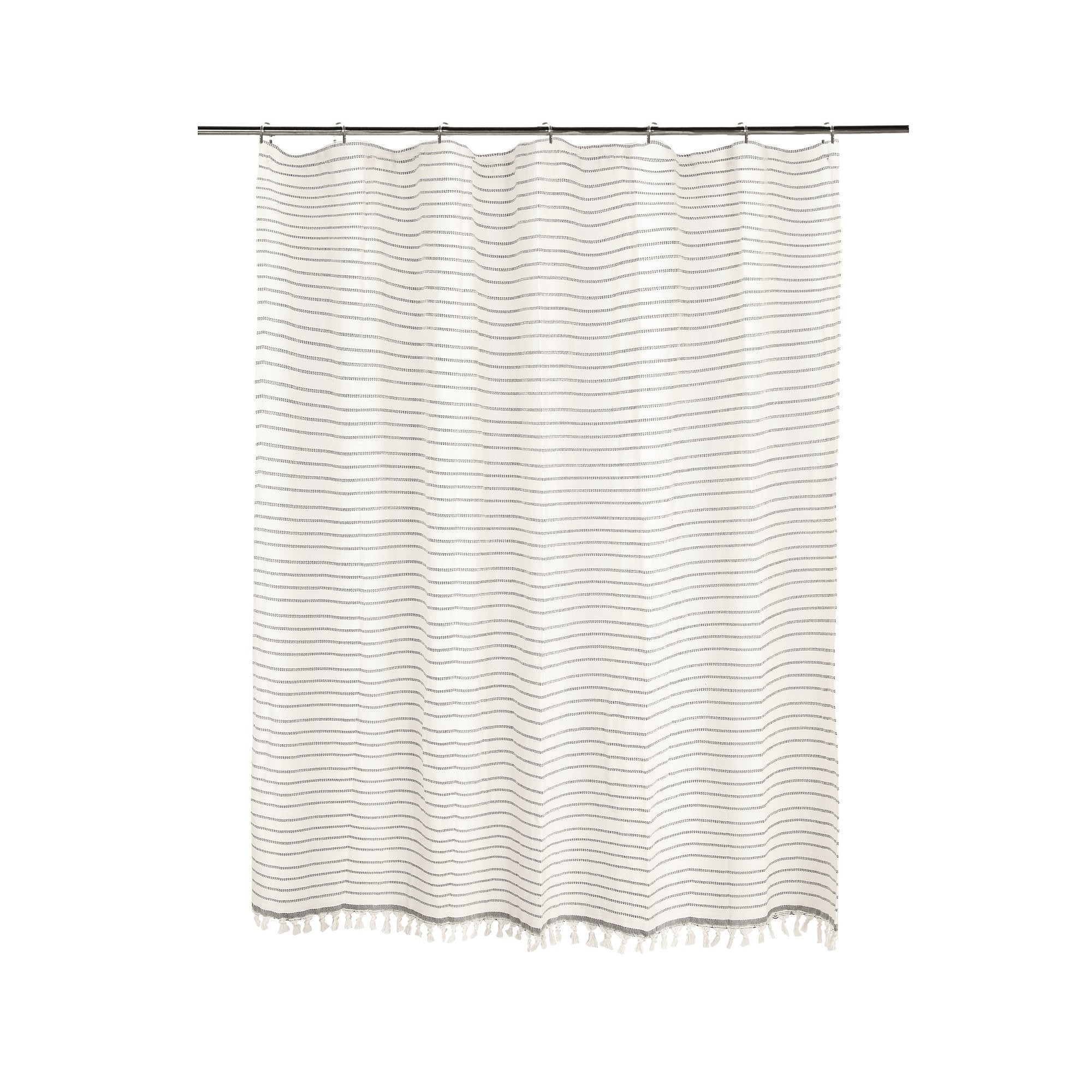 Striped shower curtain with wavy pattern on a white background