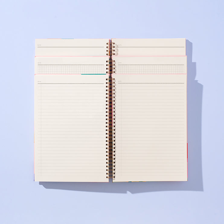 Open notebook with lined pages on a light blue background