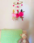 Pink nursery mobile with three ballerina design