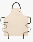 White apron with green straps on a white background