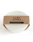 White bowl with a brown label reading 'Luma Afrika' on a white background