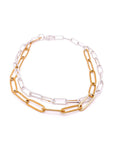 Two chain necklaces, one gold and one silver, on a white background