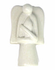 A hand-carved soapstone sculpture of an angel holding a eternal flame, with variations in color from cream to pink to gray to earthy gold