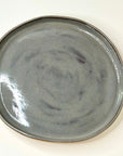 Gray ceramic plate on a white background