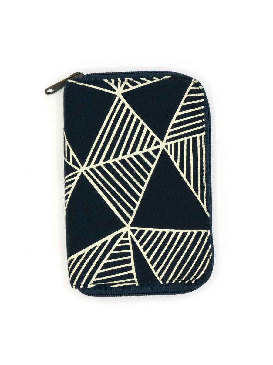 A navy blue zippered jewelry travel organizer with a geometric pattern, featuring compartments for organizing jewelry such as earrings, rings, and necklaces.