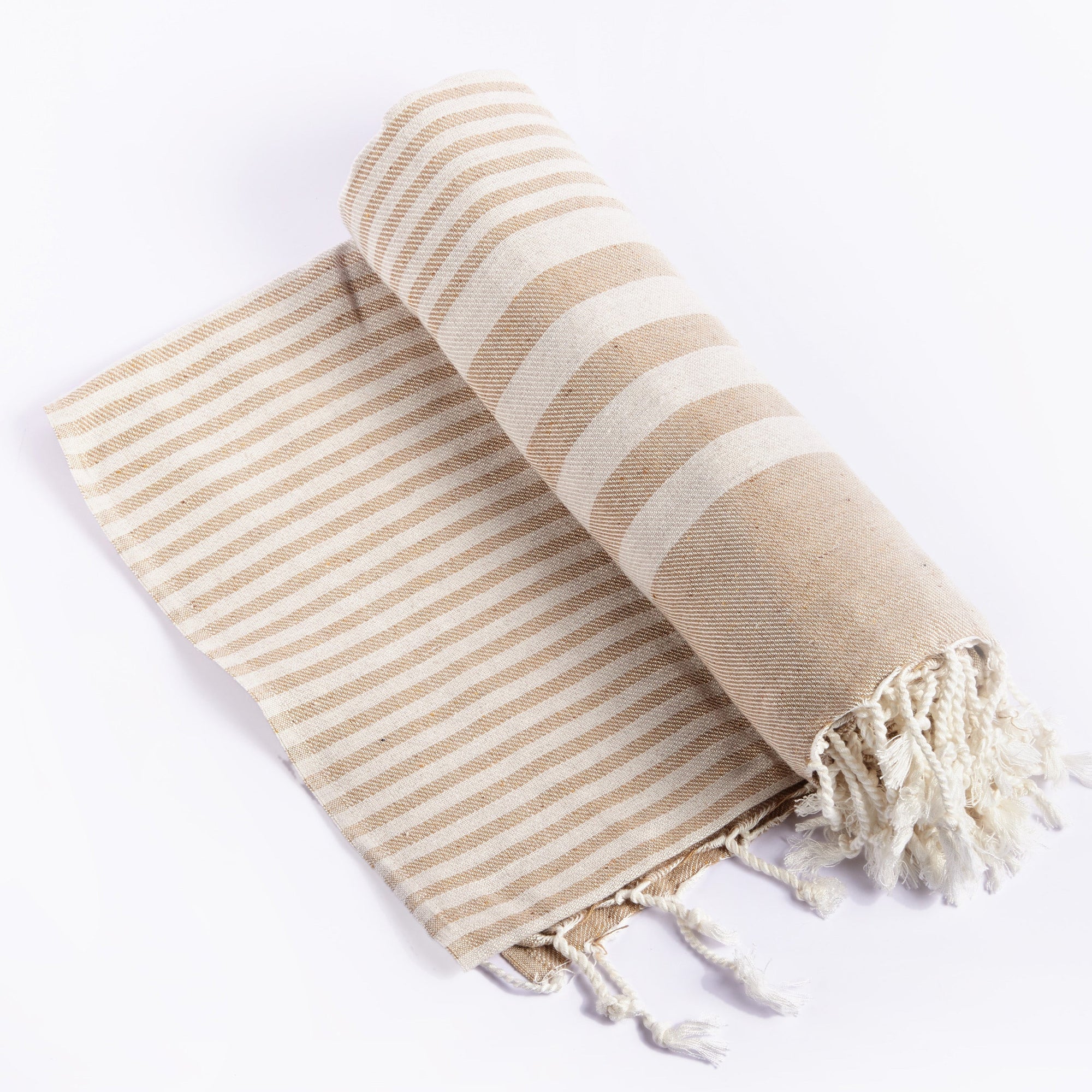 A rolled-up beige striped throw blanket with white stripes and fringes at the end, laid out on a white background