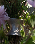 Decorative leaves with pink flowers and green leaves on a white background