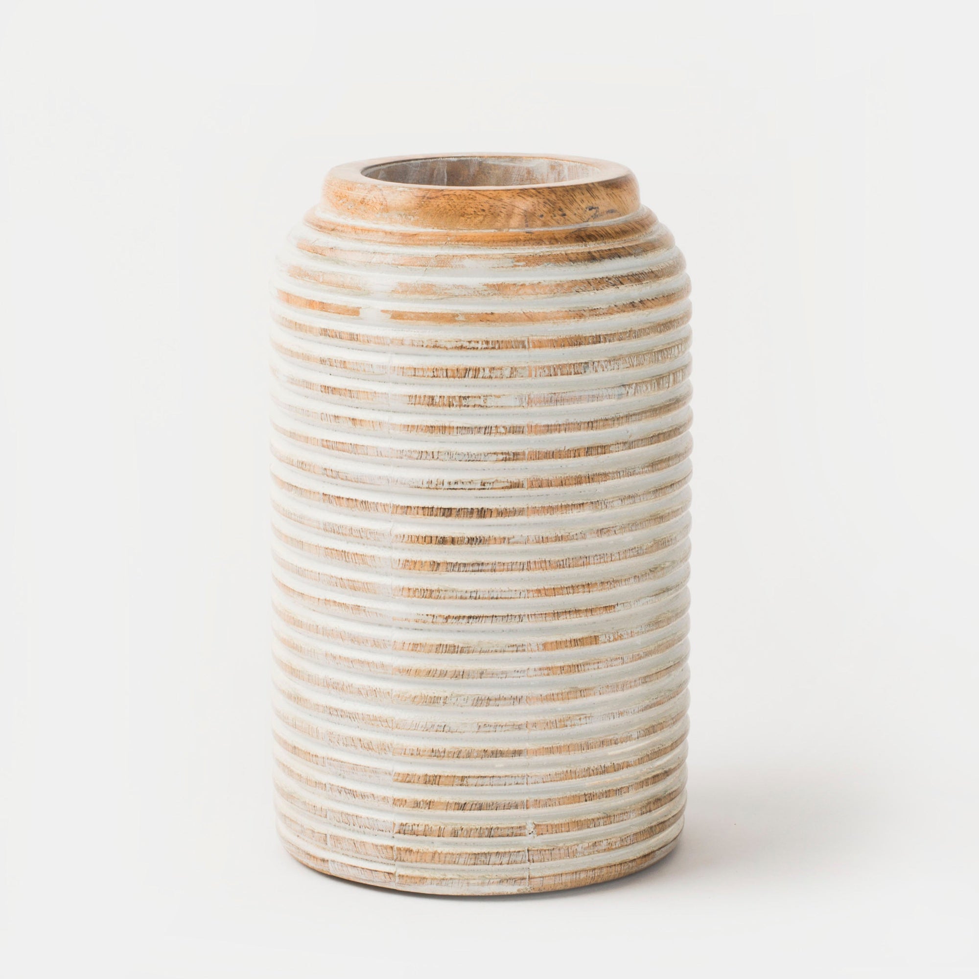 A cylindrical Etchra vase made of mango wood with horizontal carved lines, displaying a rustic grey color