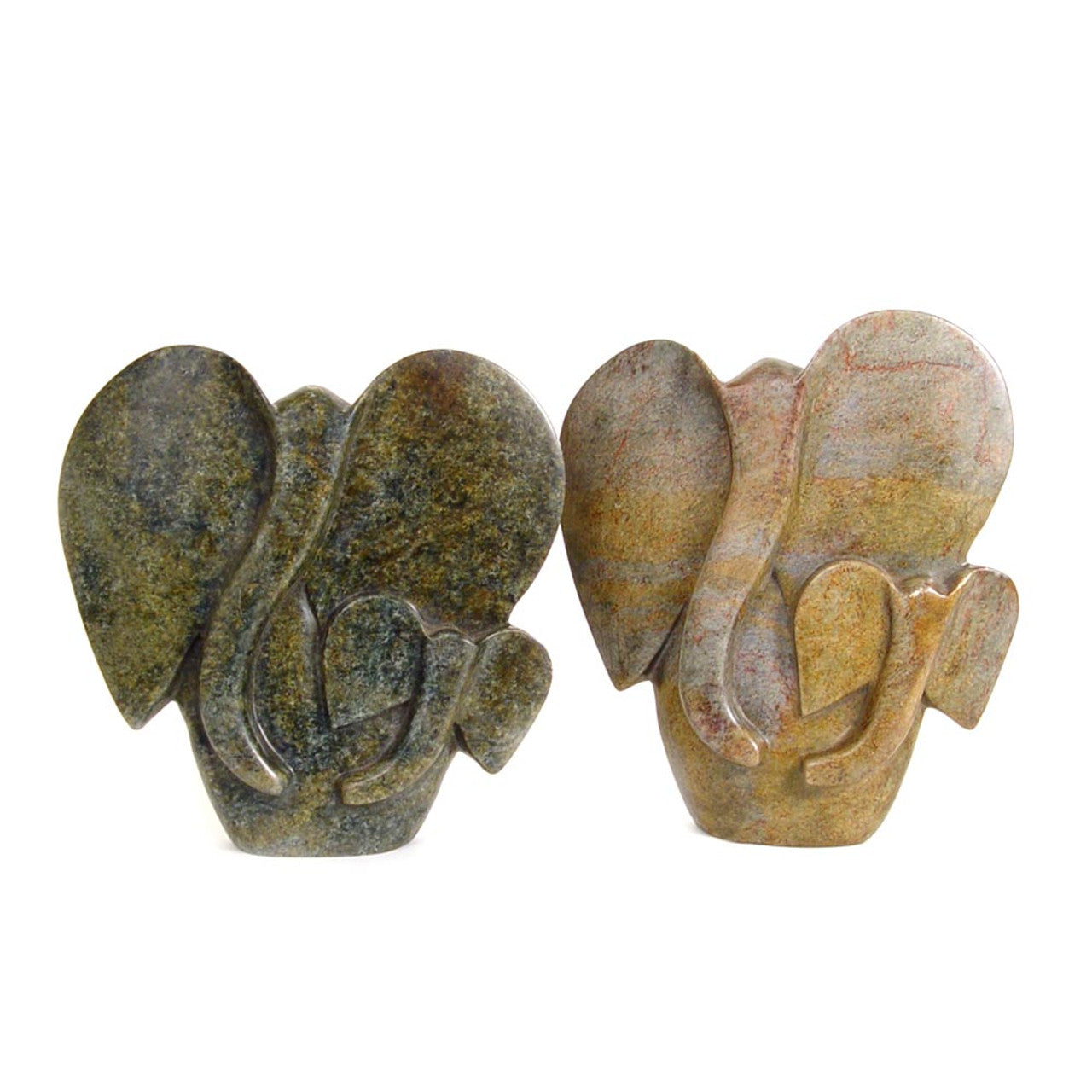 Two stone sculptures of abstract shapes on a white background