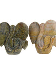 Two stone sculptures of abstract shapes on a white background