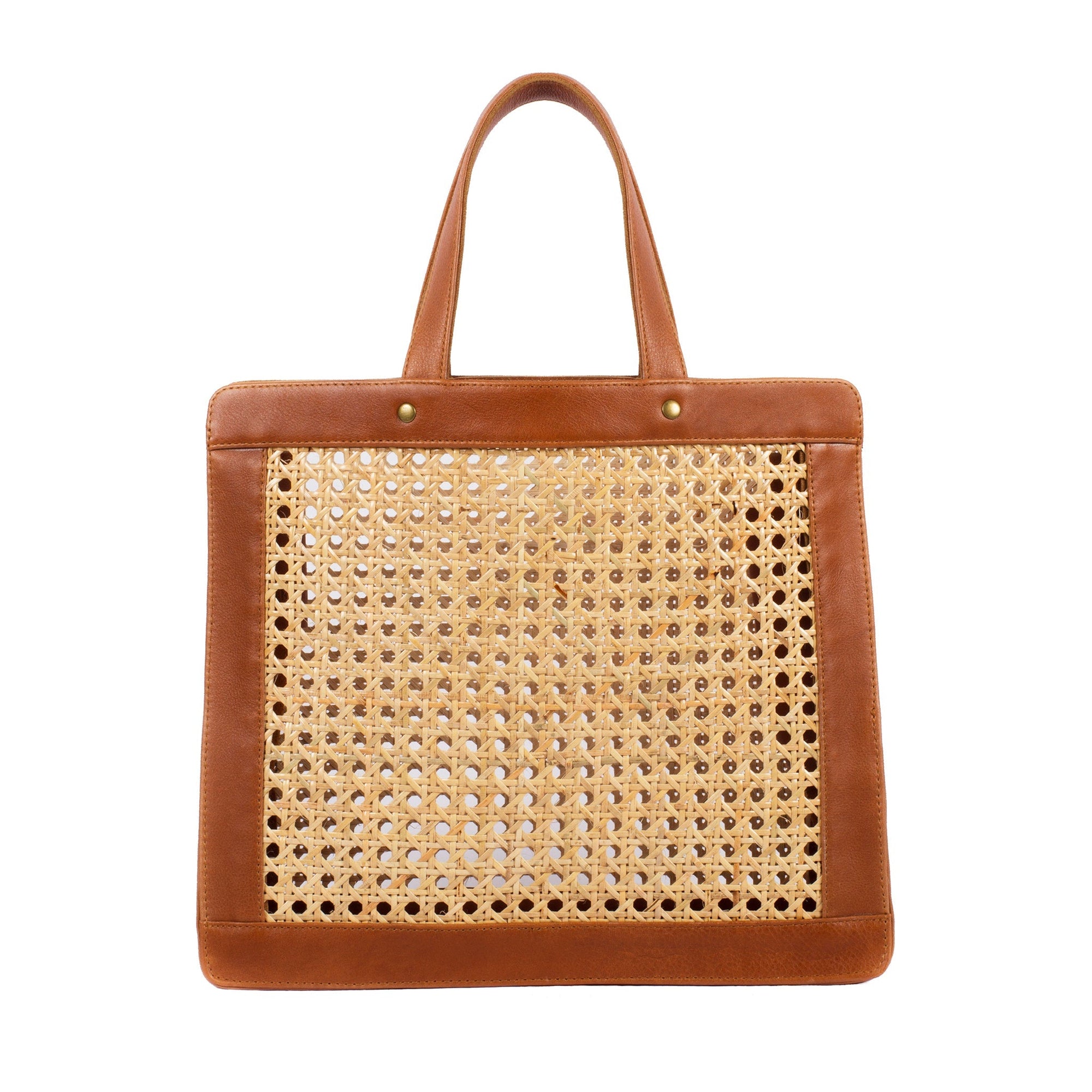 A brown leather tote bag with rattan cane webbing and leather handles.