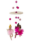 A hand-felted mobile featuring three pink and white felt ballerinas with a beige base, hanging from a chain of pink and white balls.
