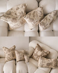 Floral-patterned pillows on a beige sofa with a collage effect