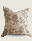 Decorative pillow with floral pattern on a beige background