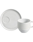 White ceramic cup and saucer set on a white background