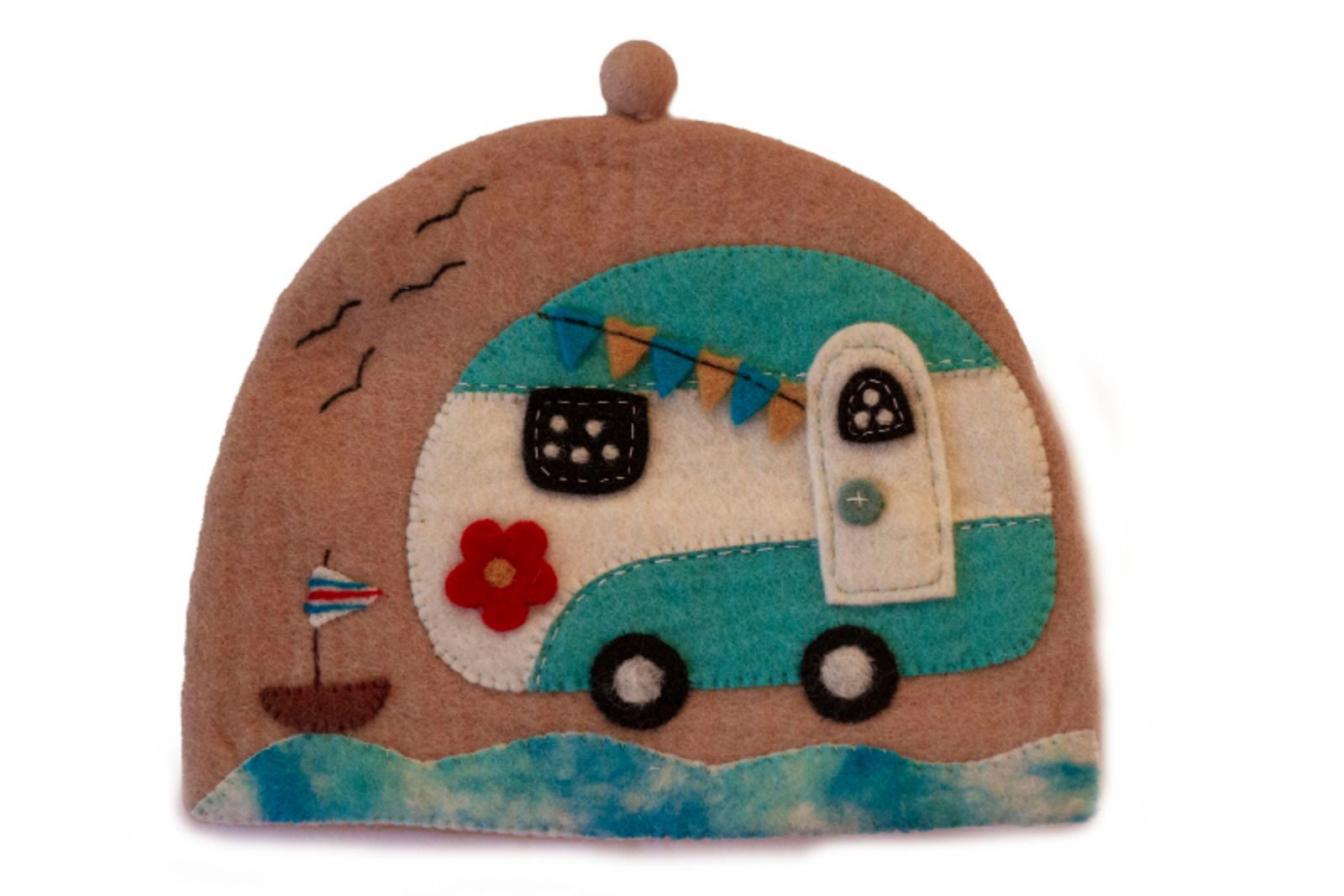 A handcrafted felt tea cozy with a design resembling a camper van, featuring various colors and decorative elements such as a boat and a flower