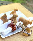 Napkin rings desiged as a variety of safari animals with napkins inside