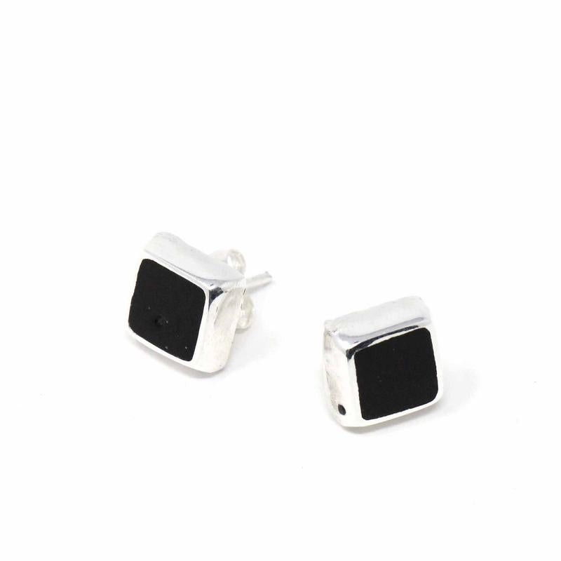 Black square stud earrings crafted with sterling silver displayed on a white background
