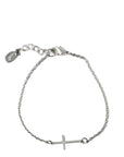 Silver bracelet with a cross charm on a light gray background