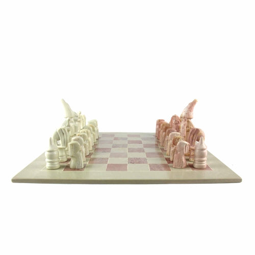Hand-carved soapstone Maasai chess set on a 14-inch square board, with pieces in pink and white soapstone.