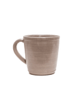 Beige ceramic mug on a white background