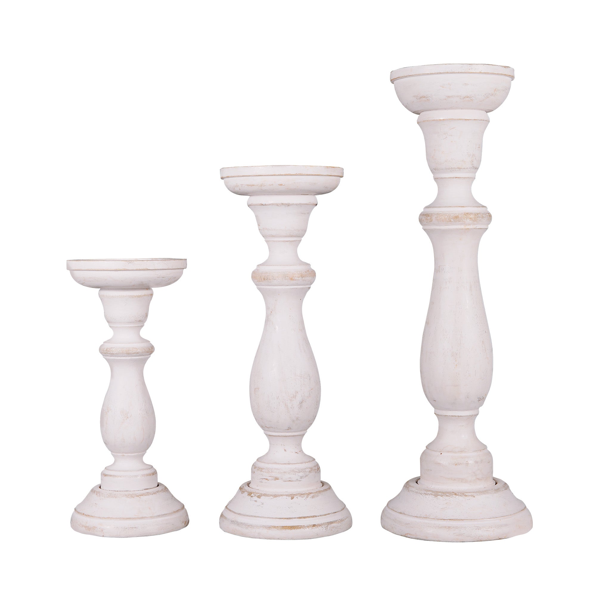 A set of three white shabby chic wooden candleholders in varying sizes