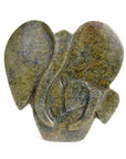 Abstract stone sculpture of an elephant parent and child duo, carved from serpentine with varying colors including black, brown, and green.