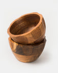 Two handcrafted wooden bowls made of acacia wood, stacked one inside the other