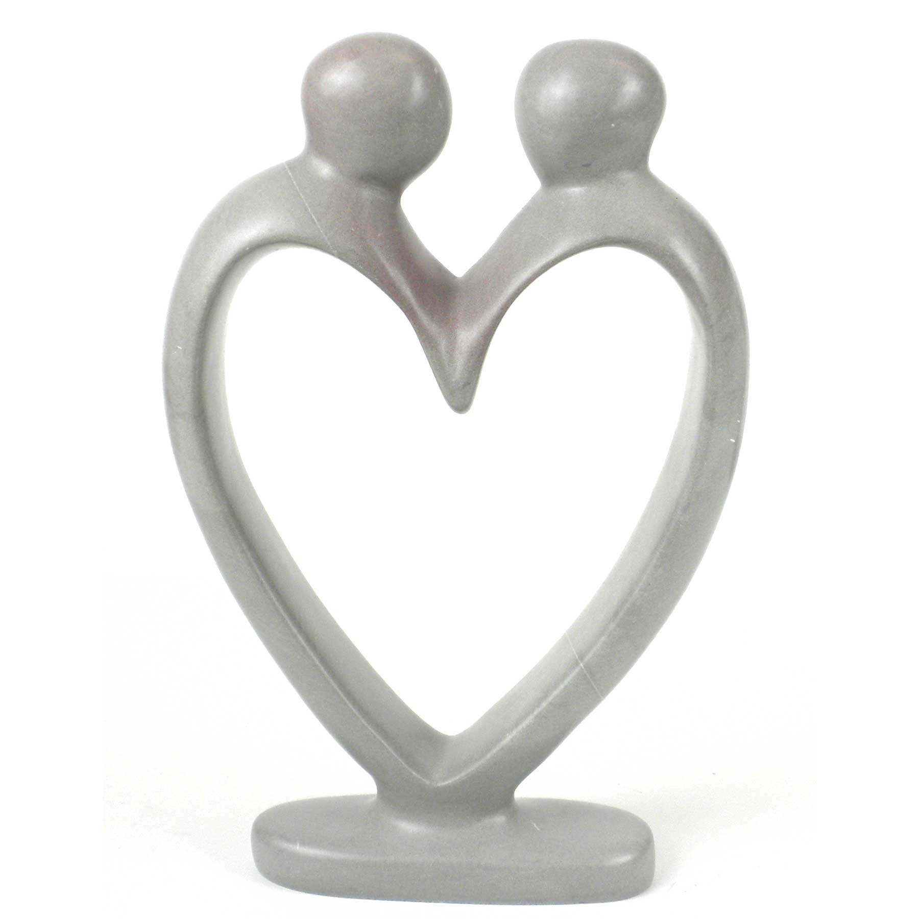 A hand-carved soapstone sculpture depicting two figures holding hands, forming a heart shape, with a predominantly gray color