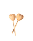 A set of teaspoons shaped like a heart displayed on a white background